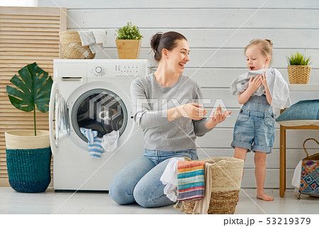 family doing laundry family doing laundry 53219379