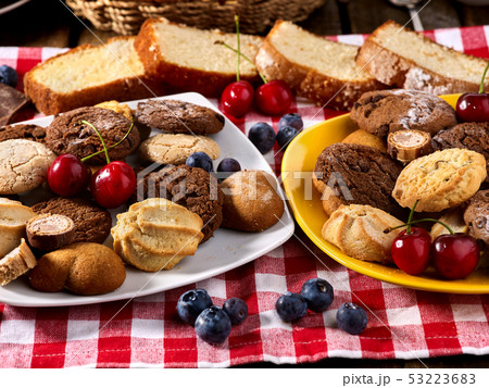 Oatmeal Cookies and sand chocolate cake with nut on table 53223683