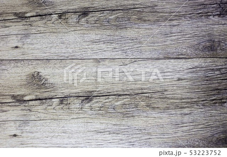 Dark brown scratched wooden cutting board. Wood 53223752