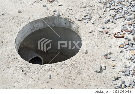Manhole without cover in new concrete block Manhole without cover in new concrete block 53224048