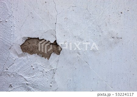 Whitewashed wall with the hole in the cracked Whitewashed wall with the hole in the cracked 53224117