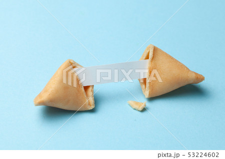 Chinese fortune cookies. Cookies with empty blank inside for prediction words. Blue background. Chinese fortune cookies. Cookies with empty blank inside for prediction words. Blue background. 53224602