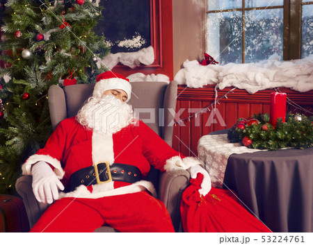 Photo of happy Santa Claus with big bag of 53224761