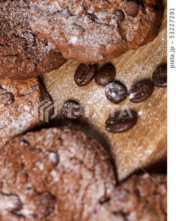 Oatmeal chocolate cookies with coffee grains and cherry. Sun flare Oatmeal chocolate cookies with coffee grains and cherry. Sun flare 53227291