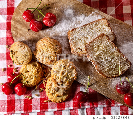 Oatmeal cookies snack and cherry breakfast close up Oatmeal cookies snack and cherry breakfast close up 53227348