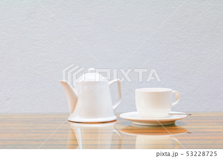 coffee cup and teapot white On the glass table 53228725