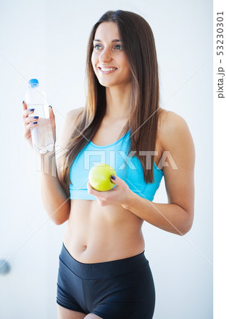 Diet and Drinking Water. Woman with bottle of water Diet and Drinking Water. Woman with bottle of water 53230301