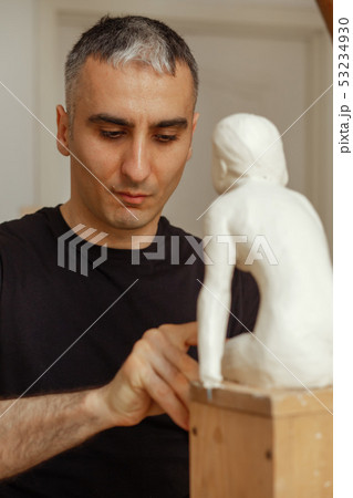 sculptor at work sculptor at work 53234930