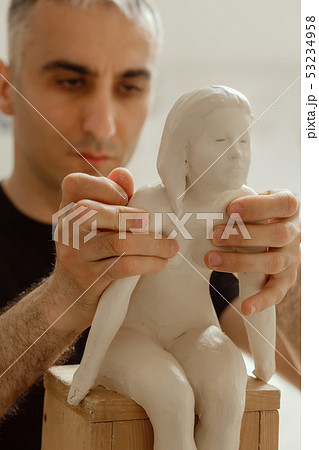 sculptor at work sculptor at work 53234958