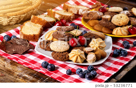 Oatmeal Cookies and sand chocolate cake with blueberries sun flare 53236771