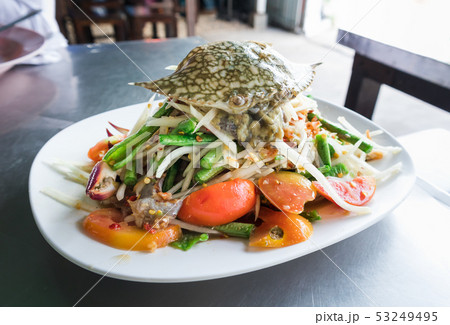 Spicy papaya salad with raw blue crab 53249495