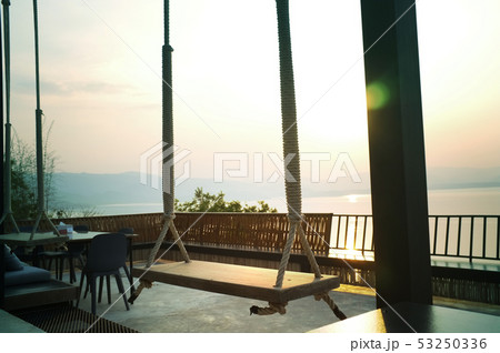 Wood swing of beautiful sunset on Khuean Wood swing of beautiful sunset on Khuean 53250336