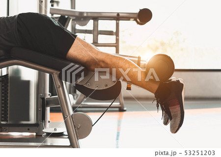 Close up of sport man stretching and lifting Close up of sport man stretching and lifting 53251203