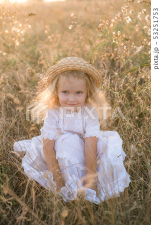 little girl with blond hair in a summer field little girl with blond hair in a summer field 53251753