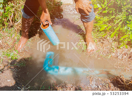 broken pipe in hole with water motion at roadside broken pipe in hole with water motion at roadside 53253394