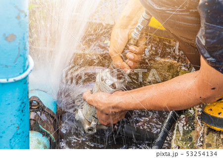 plumber working repair the broken pipe and replace 53254134