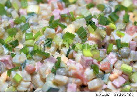 Salad Olivier sprinkled with green onions, 53261439