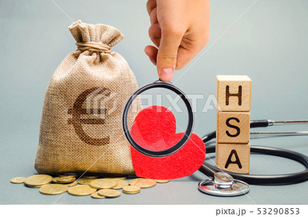 Wooden blocks with the word HSA and money bag Wooden blocks with the word HSA and money bag 53290853