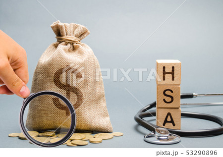 Wooden blocks with the word HSA and money bag Wooden blocks with the word HSA and money bag 53290896