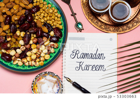 Ramadan Kareem note with snacks and coffee Ramadan Kareem note with snacks and coffee 53303663