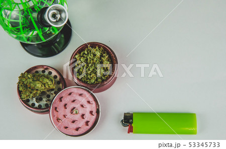 Medical marijuana buds with bong and grinder Medical marijuana buds with bong and grinder 53345733