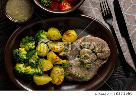 Slow roast leg of lamb with roasted potatoes. Slow roast leg of lamb with roasted potatoes. 53351966