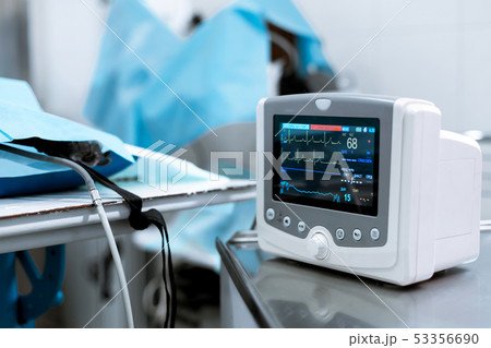 Cardiac monitor at operating table with dog on 53356690