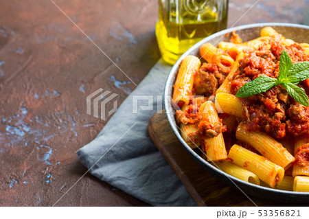 Delicious rigatoni pasta with tomato meat ragu Delicious rigatoni pasta with tomato meat ragu 53356821