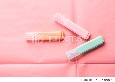 Pastel markers on coral pink background 53356907