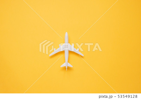Travel concept with plane on yellow background Travel concept with plane on yellow background 53549128