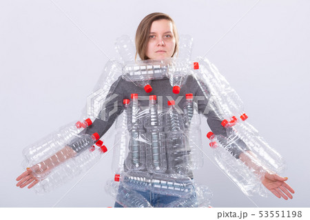 Plastic pollution problem and environment protection. Weak tired woman with plastic bottles. Save 53551198