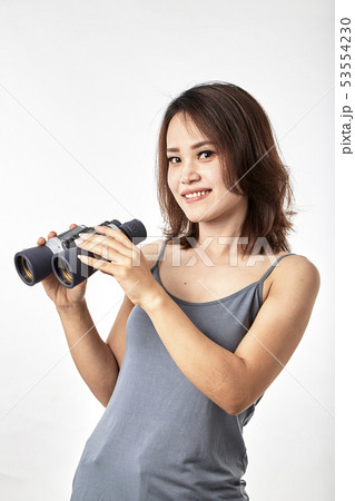Young Asian woman with binoculars Young Asian woman with binoculars 53554230