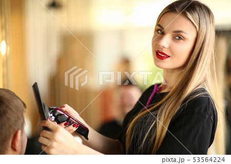 Young Hairdresser Using Electric Razor and Comb Young Hairdresser Using Electric Razor and Comb 53564224