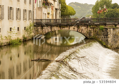 Arcades of the old bridge over the river Salat 53594604