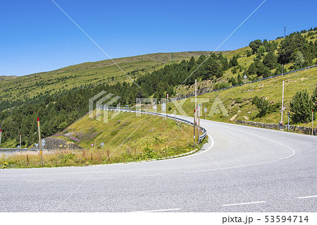 Road curves on a slope of the Pyrenees. Andorra Road curves on a slope of the Pyrenees. Andorra 53594714