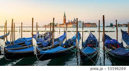 Moored Gondolas at venetian sunrise Moored Gondolas at venetian sunrise 53596269