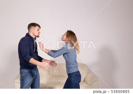 people, violence and abuse concept - angry man hitting woman 53600895
