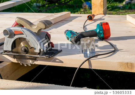 circular saw on a wooden Board circular saw on a wooden Board 53605333