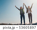 Two beautiful cool teenage girls 15-16 years old, best friends having fun, with their hands up 53605897