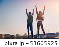 Two beautiful cool teenage girls 15-16 years old, best friends having fun, with their hands up 53605925