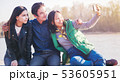 Group of trendy Asian teens with mobile phone outdoors, having fun, digital generation 53605951