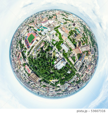 Aerial city view with crossroads and roads, houses, buildings, parks and parking lots. Sunny summer 53607316