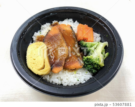 Salmon grilled with rice in the food container Salmon grilled with rice in the food container 53607881