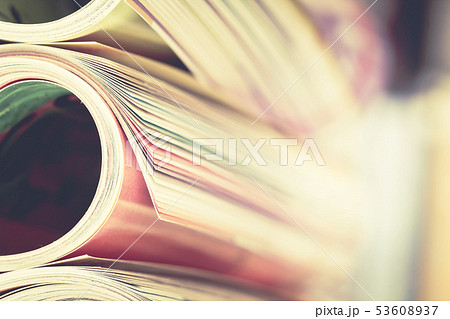 Close up edge of colorful magazine stacking roll Close up edge of colorful magazine stacking roll 53608937