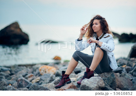 fashionable girl dressed in white jacket and wide fashionable girl dressed in white jacket and wide 53610852