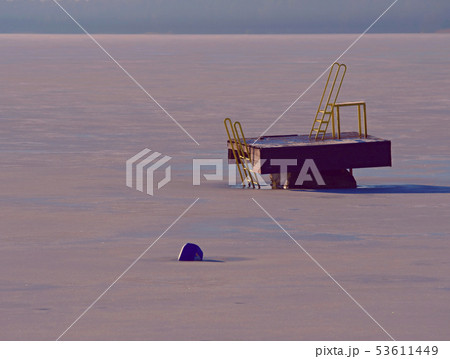 Tower of sliding track in frozen lake, icy water 53611449