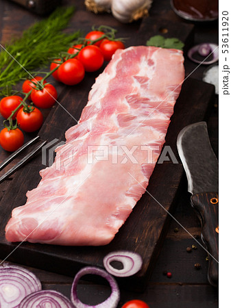 Plastic tray with raw pork ribs and vintage knife Plastic tray with raw pork ribs and vintage knife 53611920