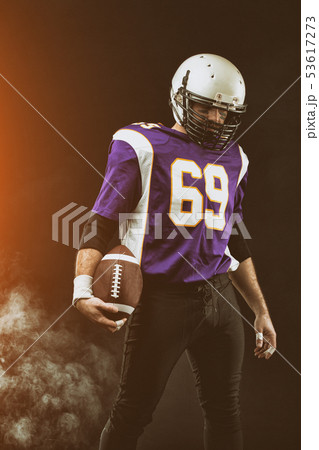 Portrait close-up, American football player, bearded without a helmet with the ball in his hands Portrait close-up, American football player, bearded without a helmet with the ball in his hands 53617273