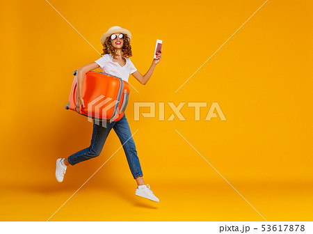 concept of travel. happy woman girl with suitcase 53617878
