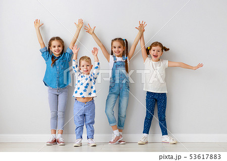 happy kids friends around empty walls. 53617883